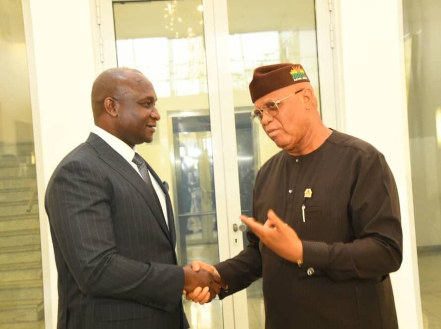 Dr Samuel Obuku shaking hands with Gov Umoh Eno Akwa Ibom State Governor